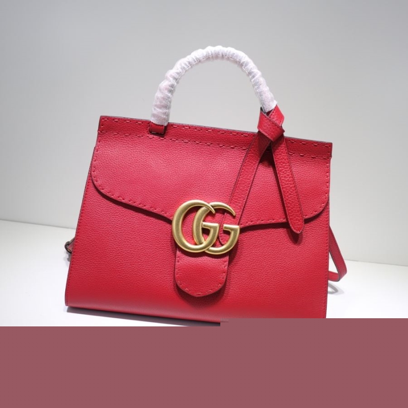 G*u*i top handle bags